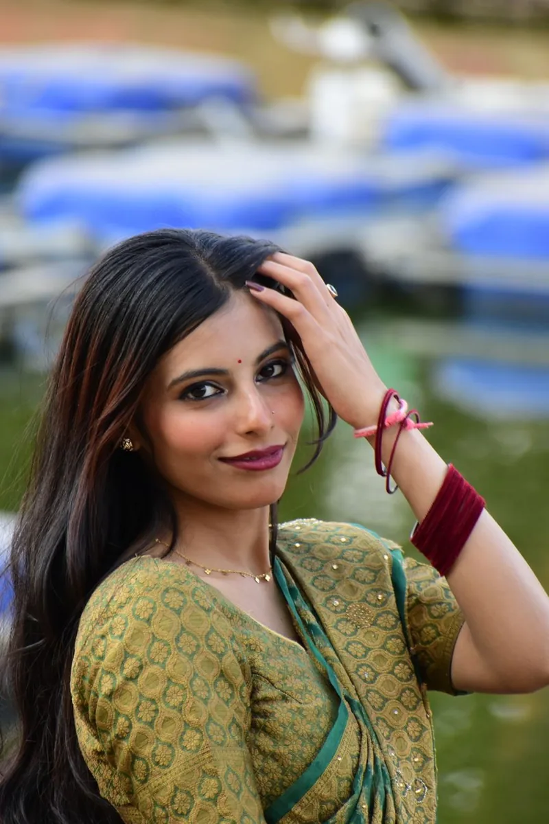 Woman wearing an elegant handloom Indian ensemble
